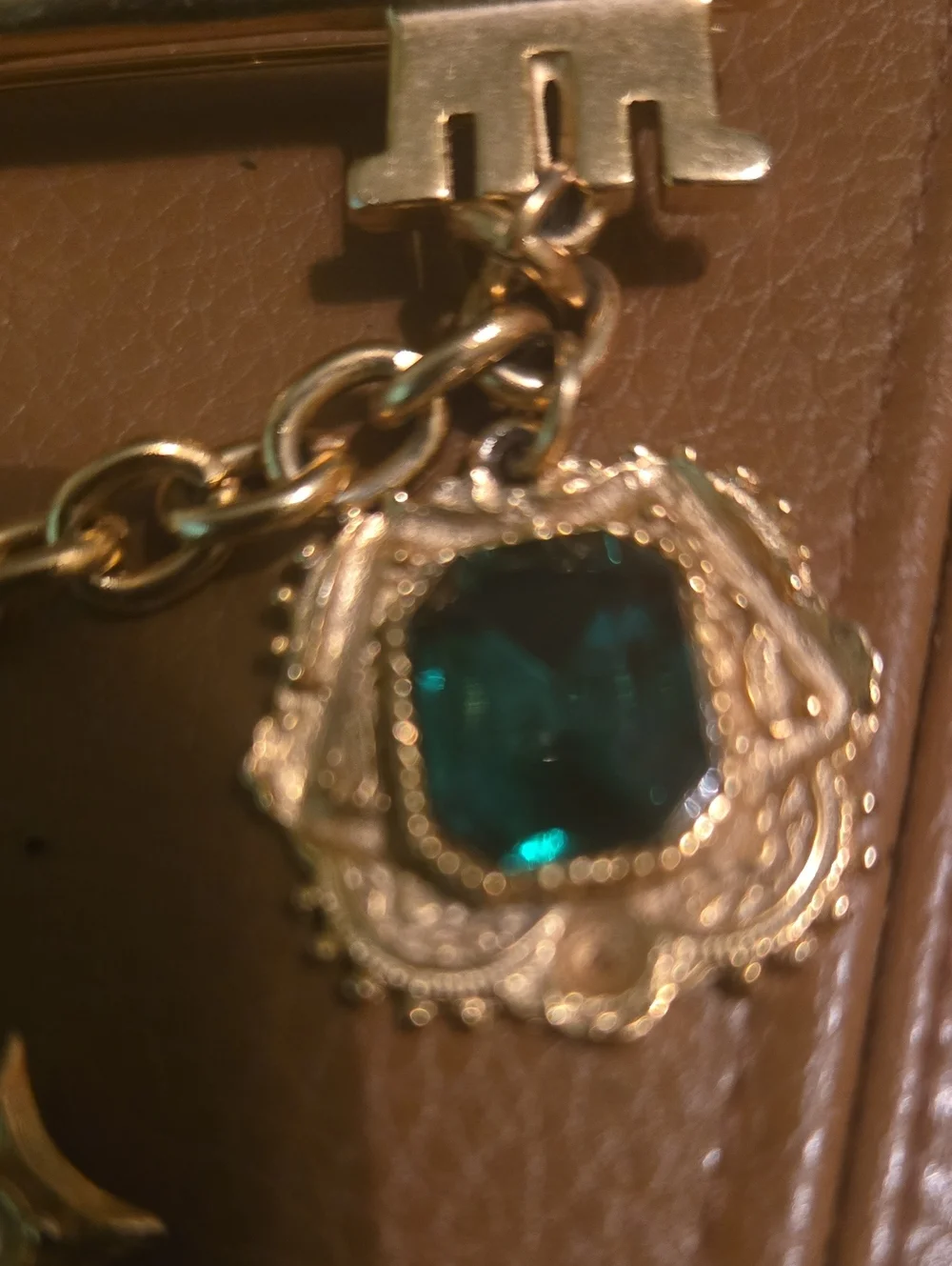 Gold-Tone Key & Charm Card Holder Accent with Green Gem and Cross Pendant
